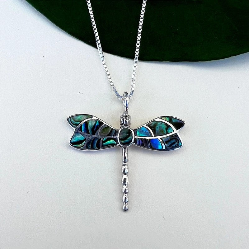Women's Peace Collection abalone dragonfly necklace featuring a detailed, colorful pendant on a delicate chain.