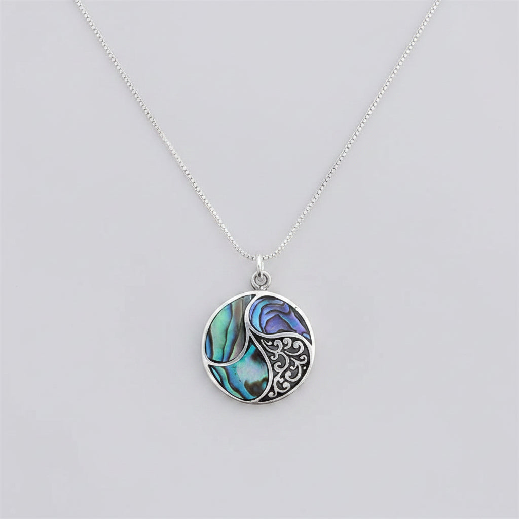 Women's Peace Collection abalone shell necklace featuring shimmering, abalone pendant on a delicate chain.