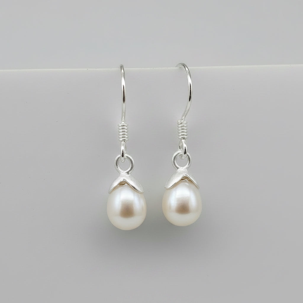 Women's Peace Collection acorn-shaped pearl earrings featuring elegant, smooth pearl drops.
