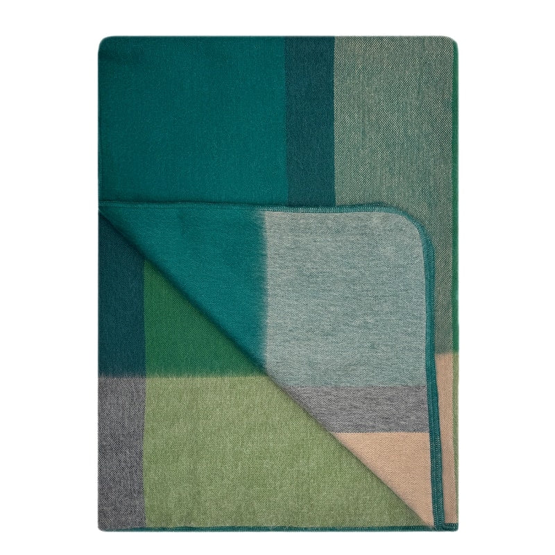 Soft alpaca throw blanket by Shupaca featuring a cozy, textured design in warm alpine tones.