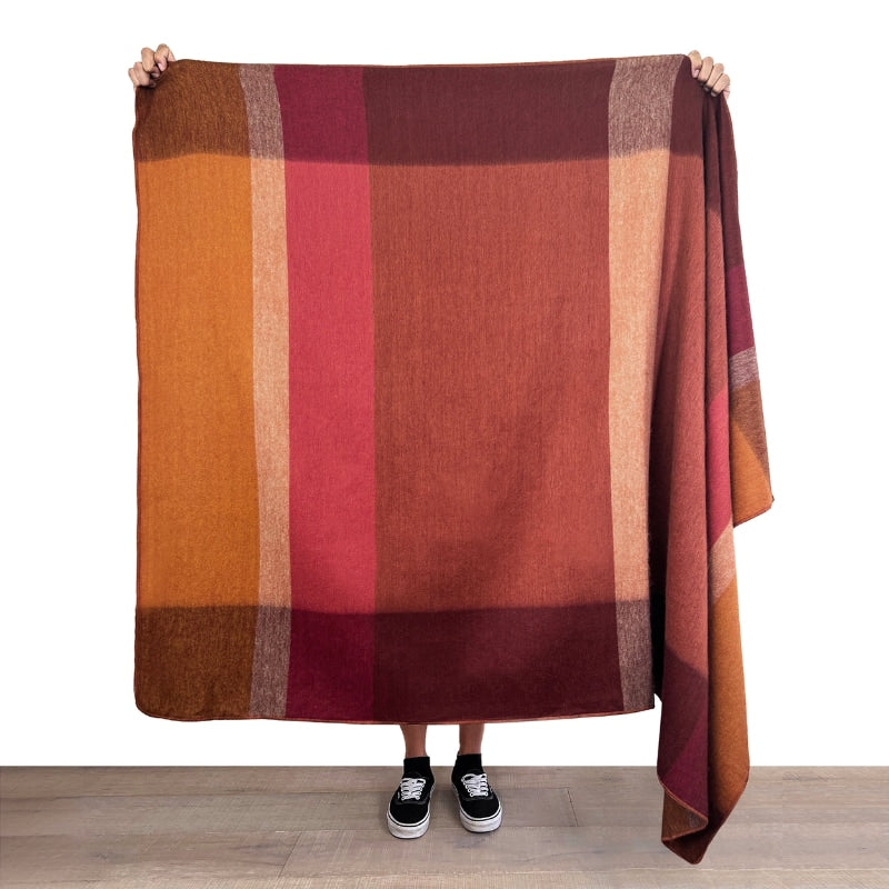 Soft amber alpaca throw blanket from Shupaca, showcasing plush, cozy alpaca fiber in a warm, inviting color.