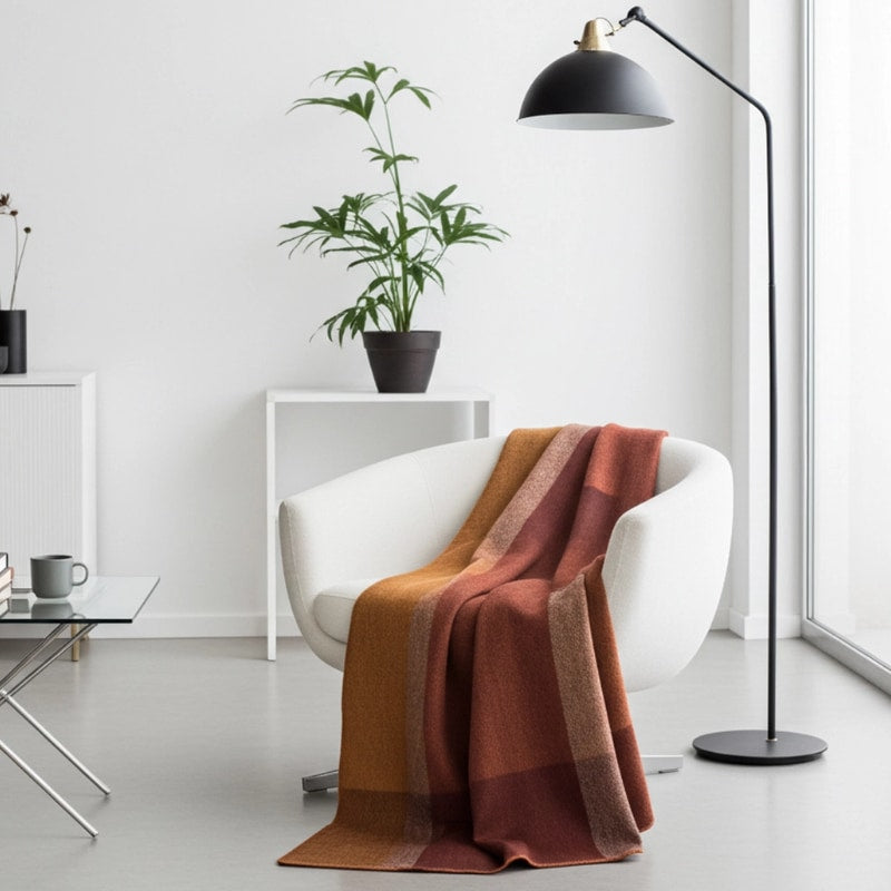 Soft amber alpaca throw blanket from Shupaca, showcasing its cozy, luxurious texture and warm color.