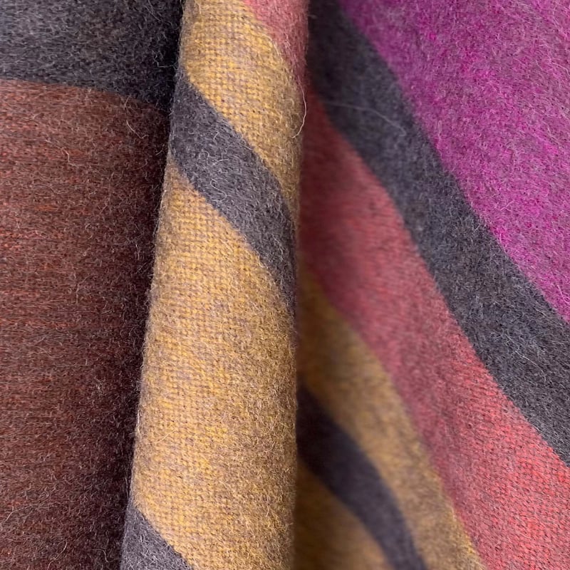 Soft alpaca throw blanket from Shupaca featuring a cozy Canyon design in warm, earthy tones, perfect for added comfort.