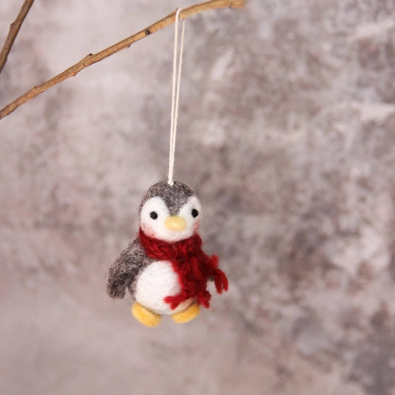 Cute Gry & Sif baby penguin ornament with detailed feathers and a charming, playful expression, ideal for holiday decor.