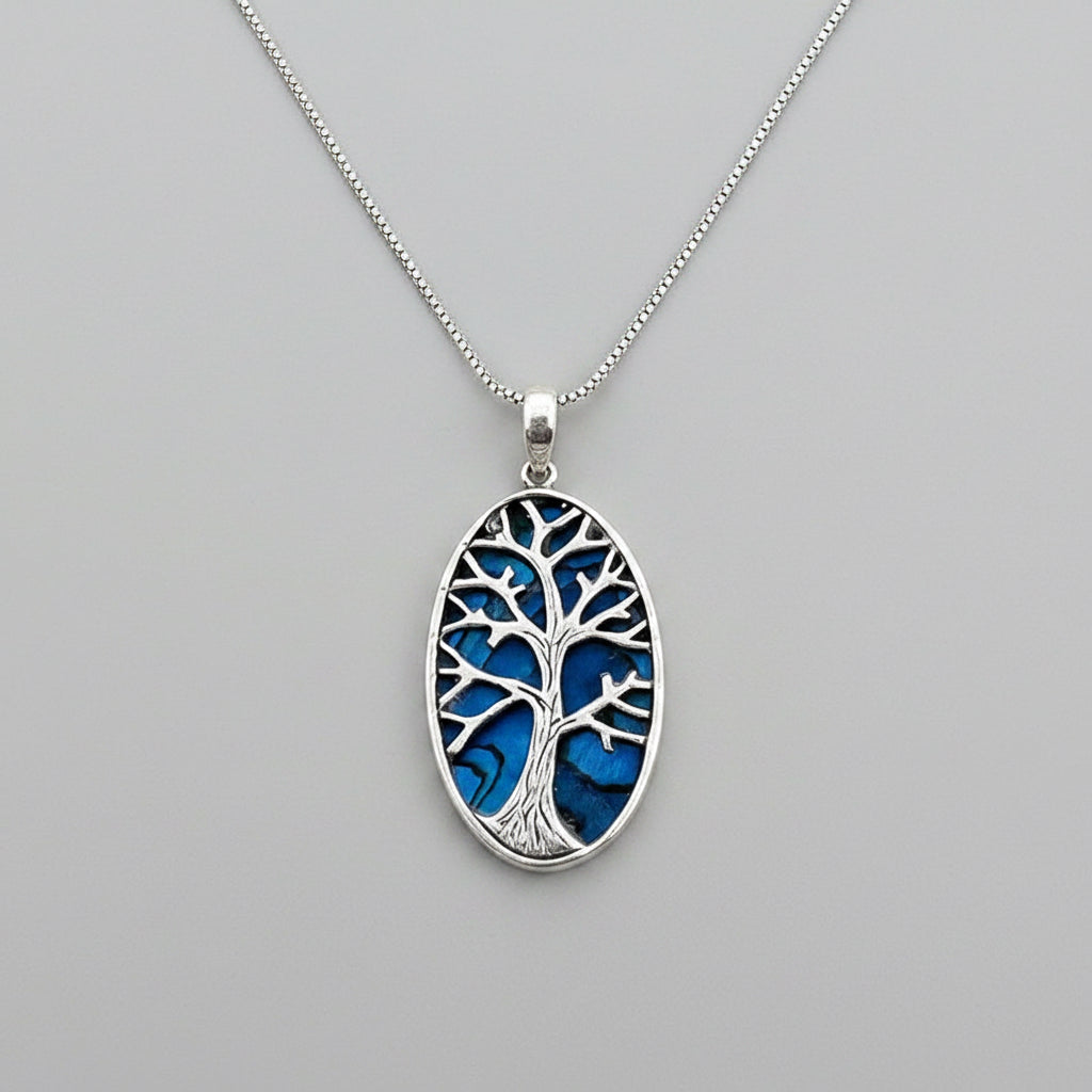 Blue Abalone Tree of Life necklace featuring a vibrant, handcrafted design from Women's Peace Collection.