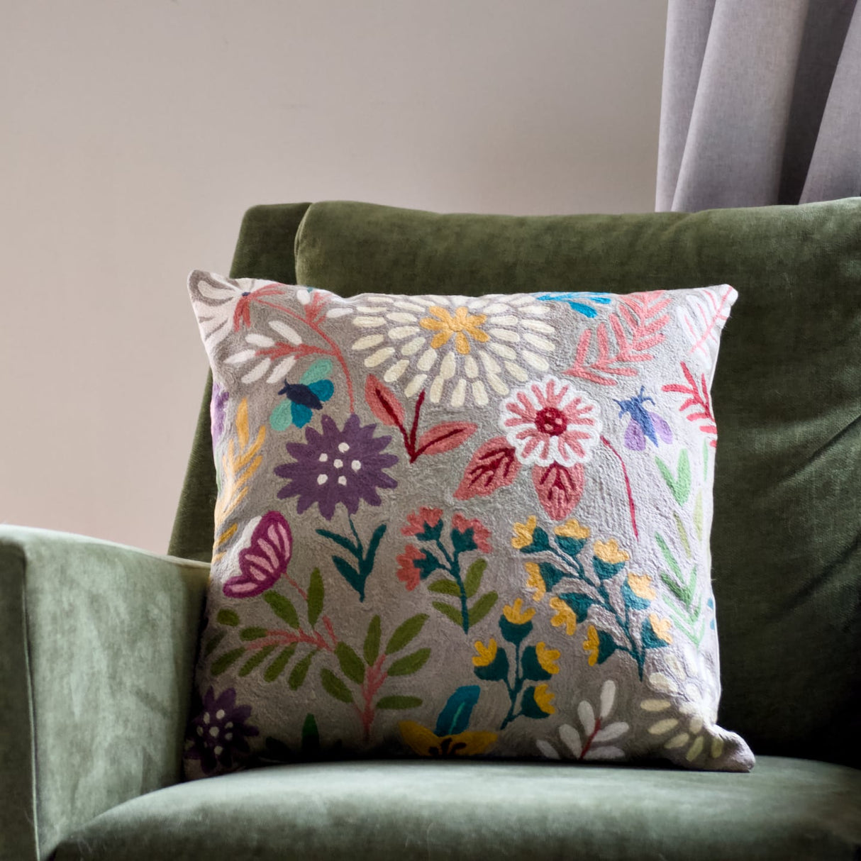 Botanical 18-inch chainstitch pillow in sandy tones, featuring floral embroidery on soft fabric.