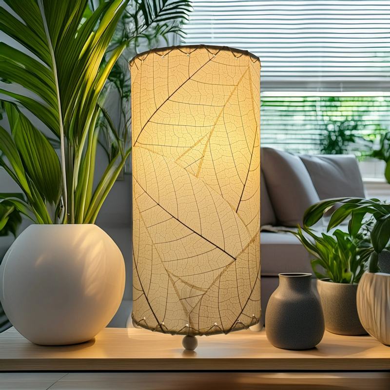 Eangee Cocoa Leaf Cylinder Table Lamp in natural finish, 12-inch height with intricate leaf design, perfect for ambient lighting.