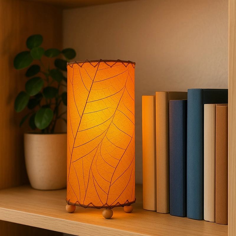 Eangee Cocoa Leaf Cylinder Table Lamp in vibrant orange, 12-inch tall with a leaf-inspired design and cylindrical shape.