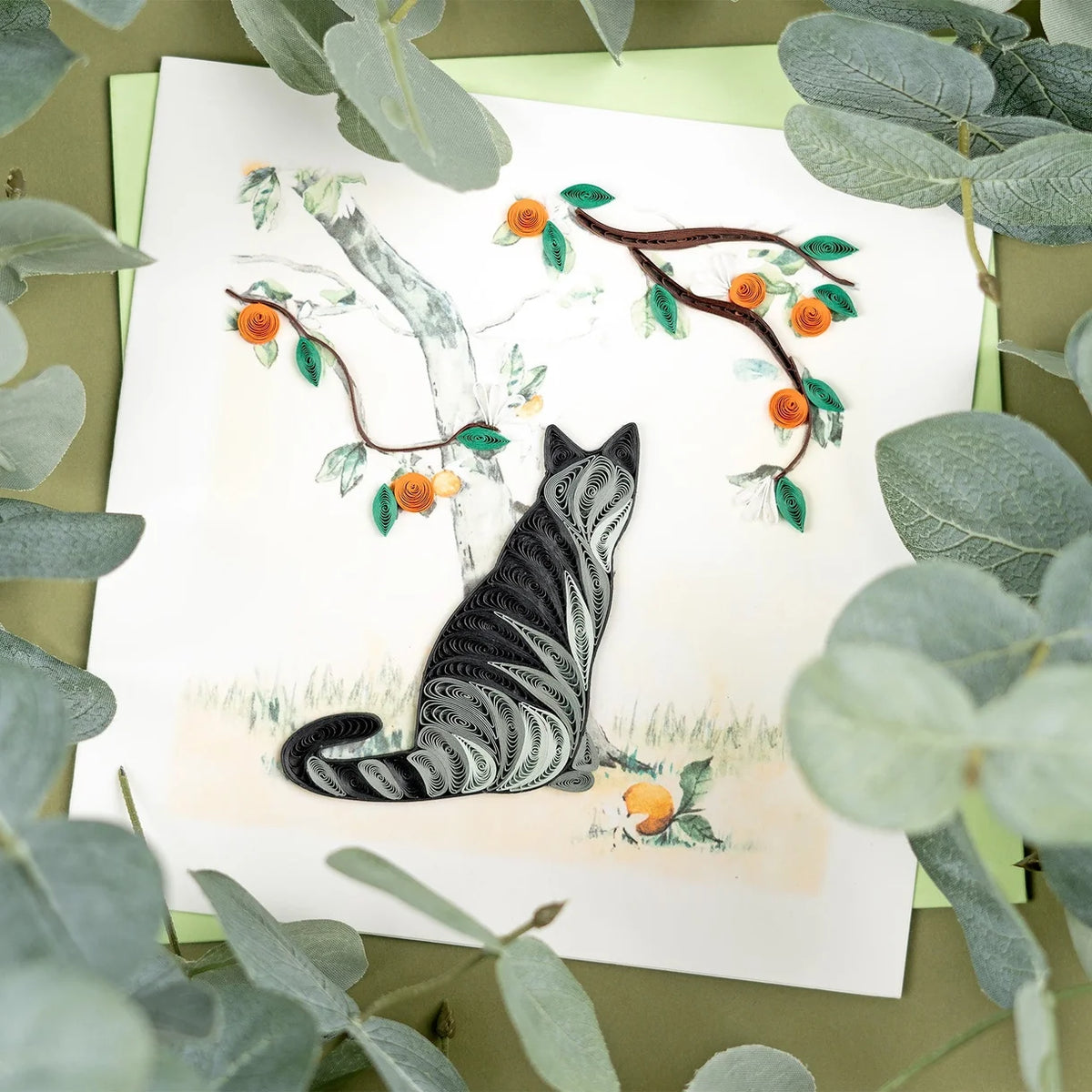 Close-up of Quilling Card featuring a detailed cat and orange branch design with intricate paper quilling artwork.