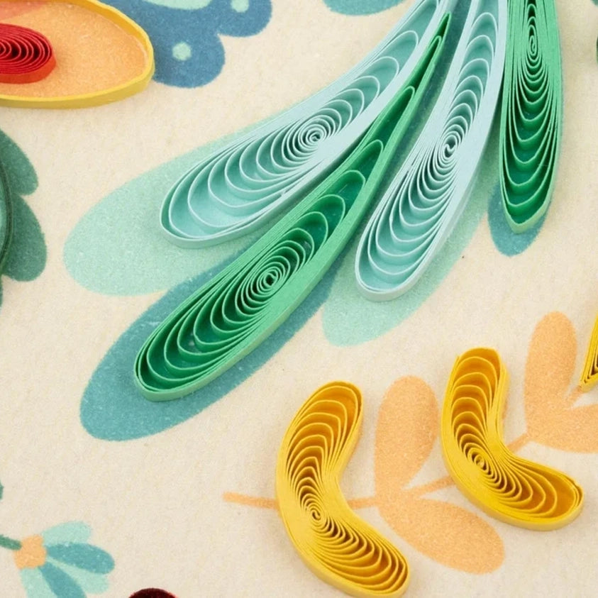 Close-up of a Quilling Card folk art design featuring intricate paper leaves, showcasing colorful quilling craftsmanship.