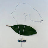 Abalone dragonfly pendant necklace from Women's Peace Collection featuring a colorful, detailed dragonfly design on a silver chain.