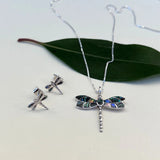 Silver abalone dragonfly stud earrings from Women's Peace Collection featuring iridescent, detailed dragonfly designs.