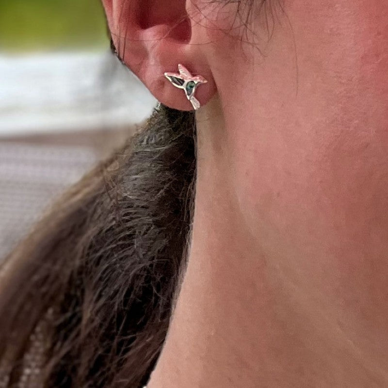 Abalone hummingbird stud earrings from Women's Peace Collection, featuring colorful, iridescent abalone shell in a delicate bird design.
