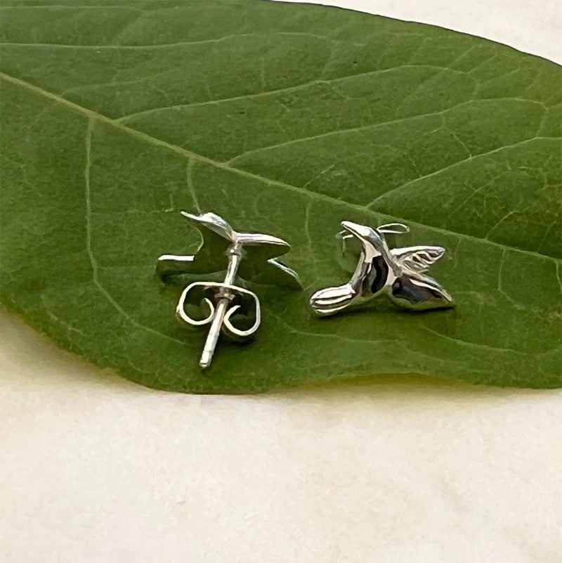 Silver abalone hummingbird stud earrings featuring detailed bird design from Women's Peace Collection