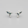 Women's Peace Collection abalone hummingbird stud earrings featuring colorful, detailed bird designs on shiny metal posts.