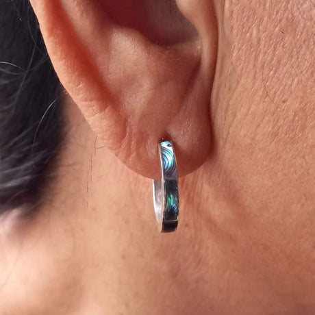 Women's Peace Collection Abalone Inlay Huggies, small silver hoop earrings with iridescent abalone shell inlay.