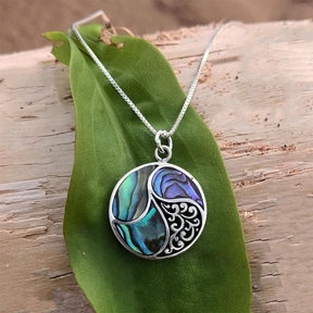 Women's Peace Collection abalone shell necklace featuring shimmering, abalone pendant on a delicate chain.
