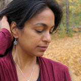 Women's Peace Collection Abalone Tree of Life earrings featuring colorful abalone shell and intricate tree design on silver earrings.