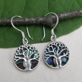 Women's Peace Collection abalone earrings featuring a detailed tree of life design, showcasing iridescent shell accents.