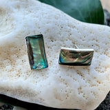 Women's Peace Collection abalone wave earrings featuring shimmering, ocean-inspired design with polished shell accents.
