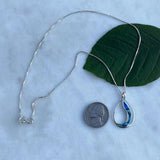 Abalone Waves Necklace from Women's Peace Collection featuring iridescent abalone shell pendants on a delicate chain.