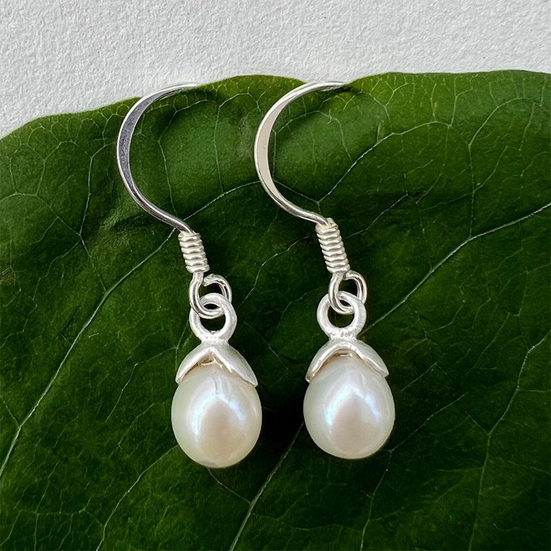 Women's Peace Collection acorn-shaped pearl earrings featuring elegant, smooth pearl drops.