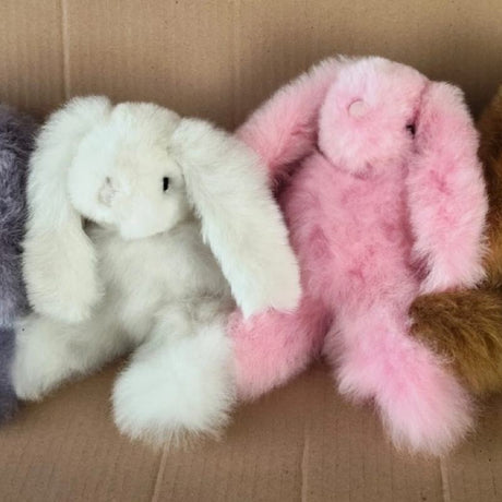 Pink alpaca fur bunny plush toy from Blossom Inspirations, soft and cuddly with realistic bunny features.