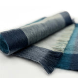 Shupaca Alpaca Plaid Scarf Summit featuring a soft, woven plaid pattern in earthy tones for cozy winter wear.