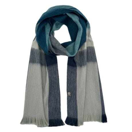 Shupaca alpaca plaid scarf featuring a cozy, soft fabric in a stylish checked pattern for warm winter wear.