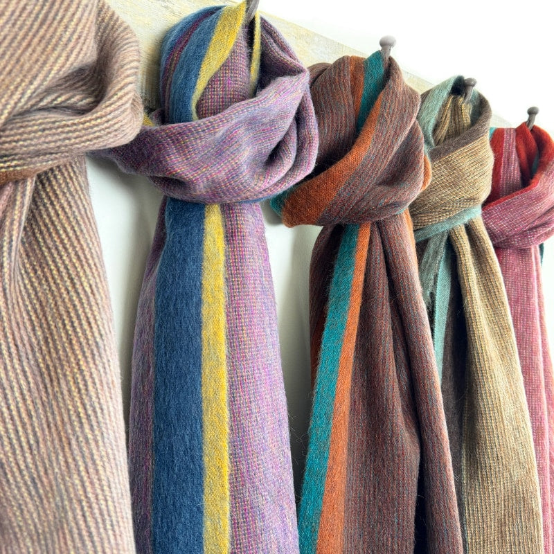 Shupaca Alpaca Sunspot scarf featuring a colorful sunburst pattern in soft, cozy alpaca fiber.