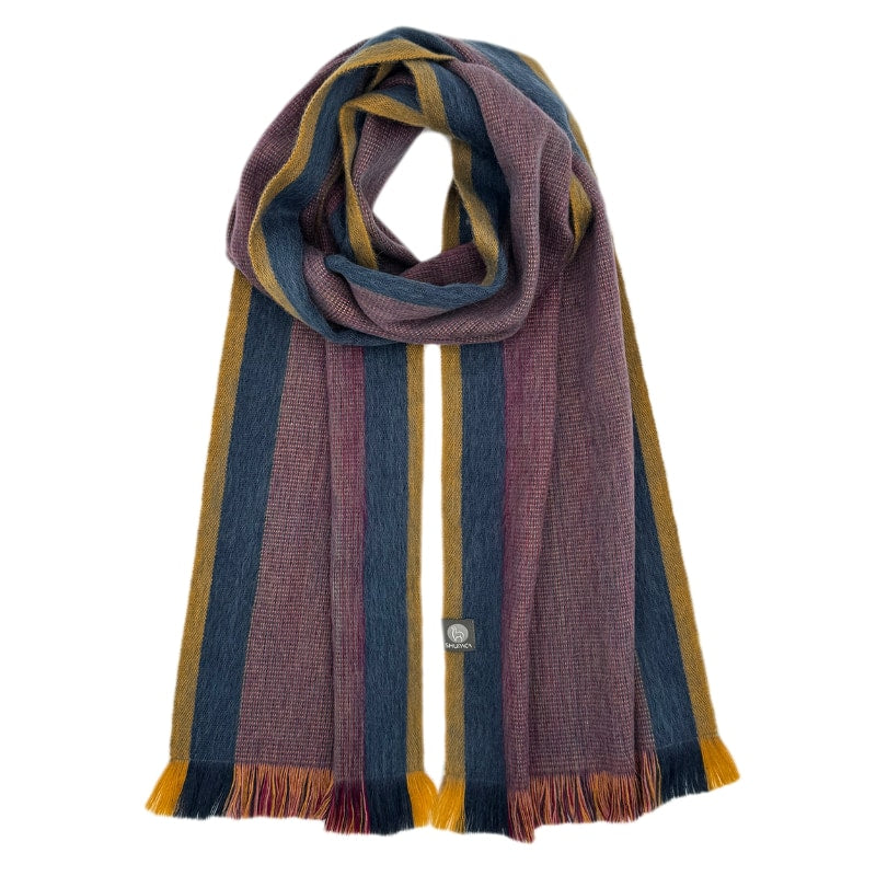 Shupaca alpaca scarf featuring a sunspot pattern, showcasing soft, luxurious fibers and vibrant, warm colors for stylish winter wear.