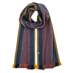 Shupaca alpaca scarf featuring a sunspot pattern, showcasing soft, luxurious fibers and vibrant, warm colors for stylish winter wear.