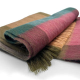 Shupaca Alpaca Plaid Scarf Wildrose featuring a soft, warm alpaca fabric with a plaid pattern in wildrose colors, draped elegantly.