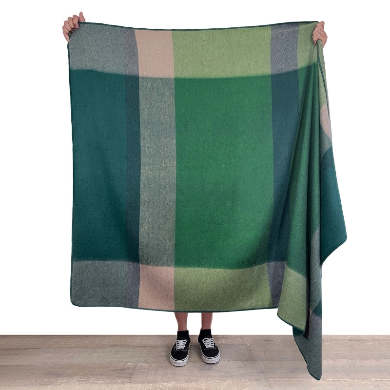 Soft Shupaca Alpaca Throw Alpine in cozy, natural tones, showcasing its textured woven pattern and luxurious alpaca fibers.