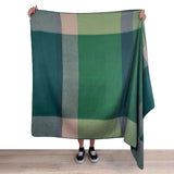 Soft Shupaca Alpaca Throw Alpine in cozy, natural tones, showcasing its textured woven pattern and luxurious alpaca fibers.