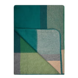 Soft alpaca throw blanket by Shupaca featuring a cozy, textured design in warm alpine tones.