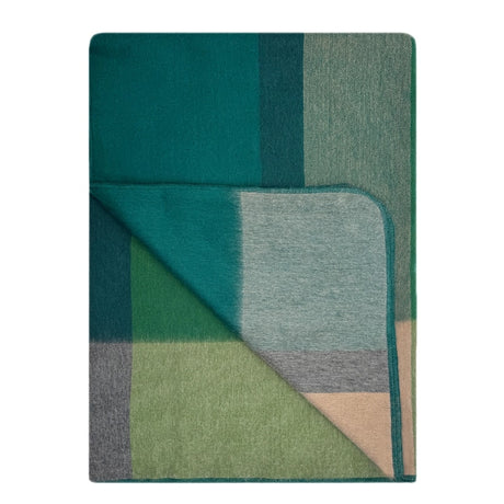 Soft alpaca throw blanket by Shupaca featuring a cozy, textured design in warm alpine tones.