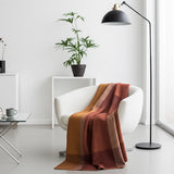 Soft amber alpaca throw blanket from Shupaca, showcasing its cozy, luxurious texture and warm color.