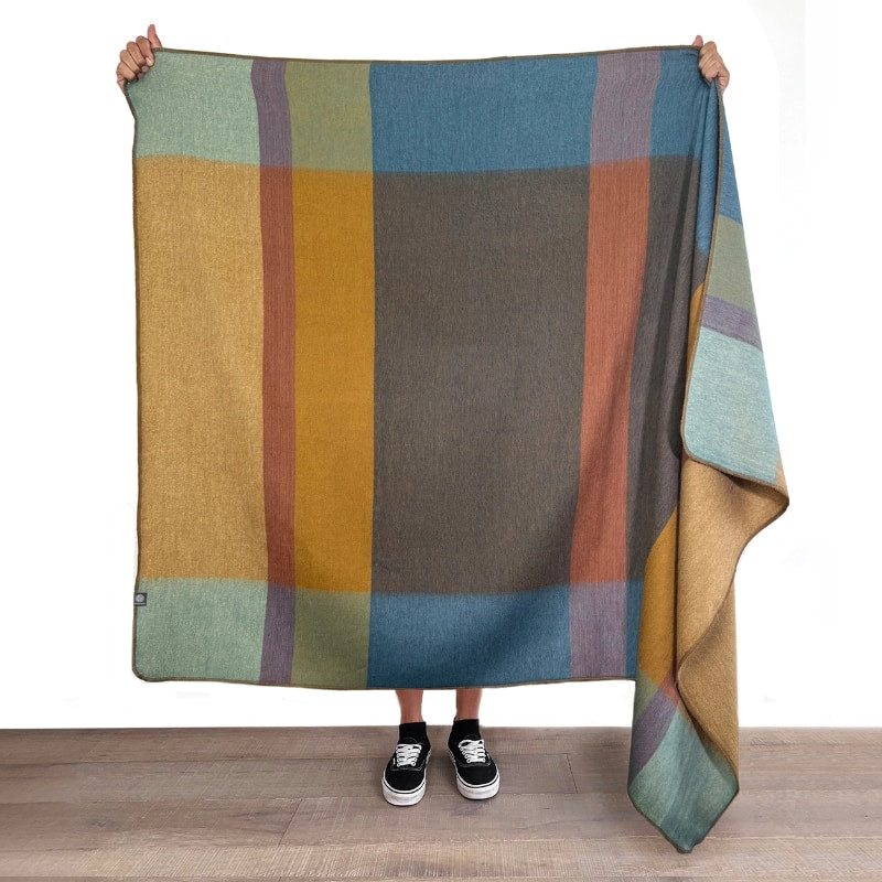 Shupaca Alpaca Throw Prism featuring soft, cozy alpaca wool in a vibrant, geometric pattern for warmth and style.