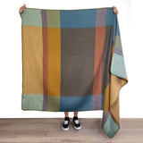 Shupaca Alpaca Throw Prism featuring soft, cozy alpaca wool in a vibrant, geometric pattern for warmth and style.