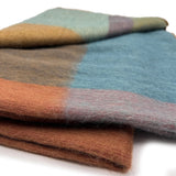 Soft alpaca throw blanket in Prism pattern from Shupaca, showcasing vibrant geometric design and cozy texture.