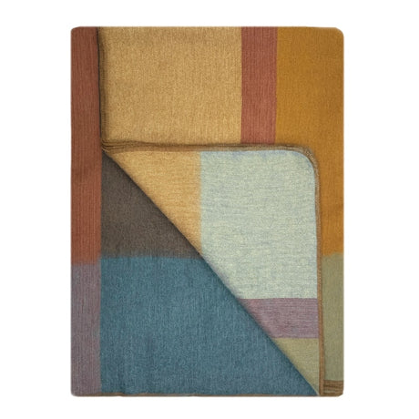 Shupaca Alpaca Throw Prism featuring soft, cozy alpaca fibers and a colorful geometric pattern for warm, stylish comfort.