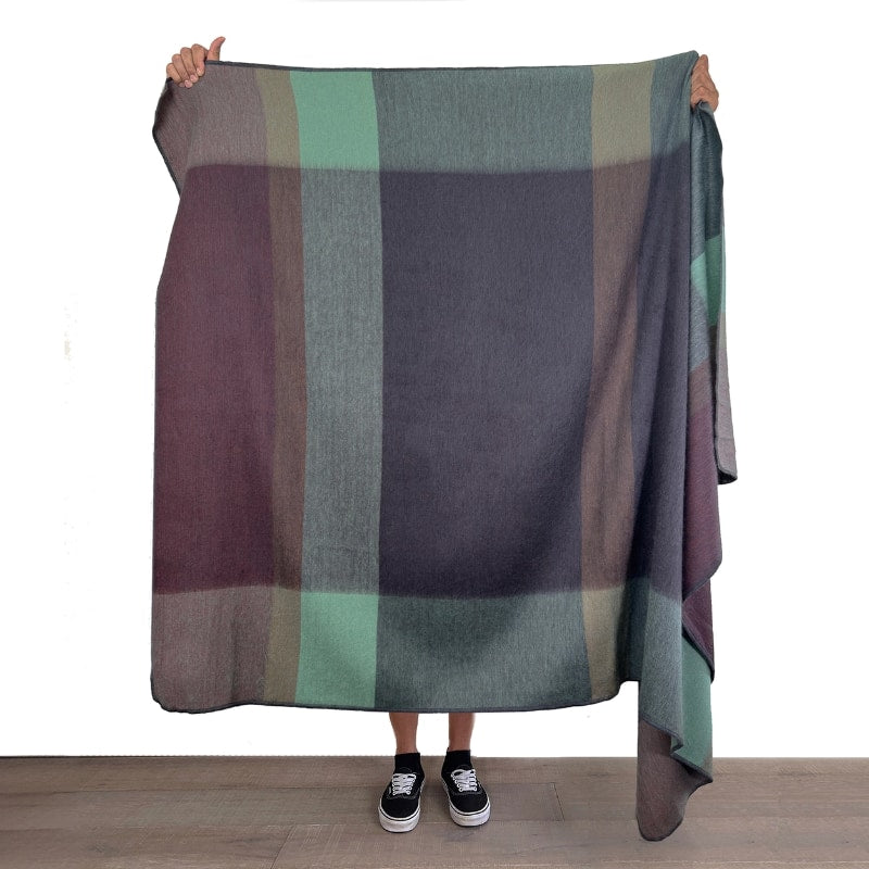 Soft alpaca throw blanket in twilight color from Shupaca, showcasing its cozy, luxurious texture and elegant drape.