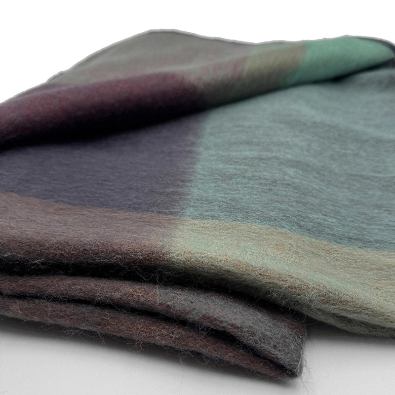 Soft alpaca throw blanket in twilight color from Shupaca, showcasing its cozy, plush texture and elegant design.