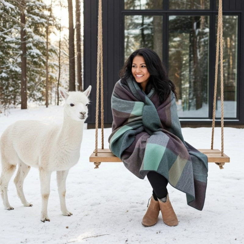Soft alpaca throw blanket in twilight color from Shupaca, showcasing its cozy, textured fabric and elegant drape.
