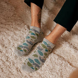 Pair of white ankle socks from Conscious Step featuring sloth protectors, designed for comfort and eco-friendly fashion.