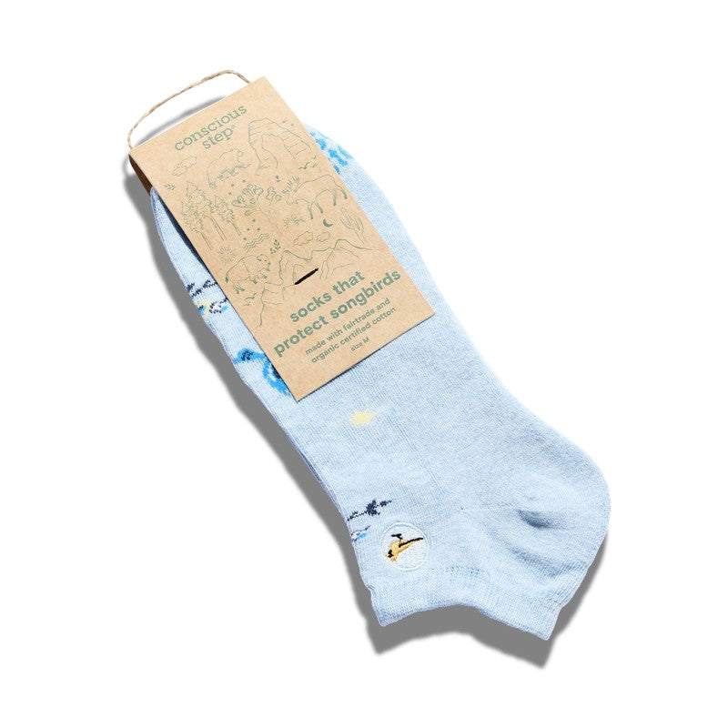 Conscious Step ankle socks featuring colorful bird illustrations, designed to protect songbirds and promote wildlife conservation.