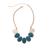 Blue Moon April Necklace by Faire Collection featuring a delicate chain with a blue moon pendant, elegant jewelry for special occasions.