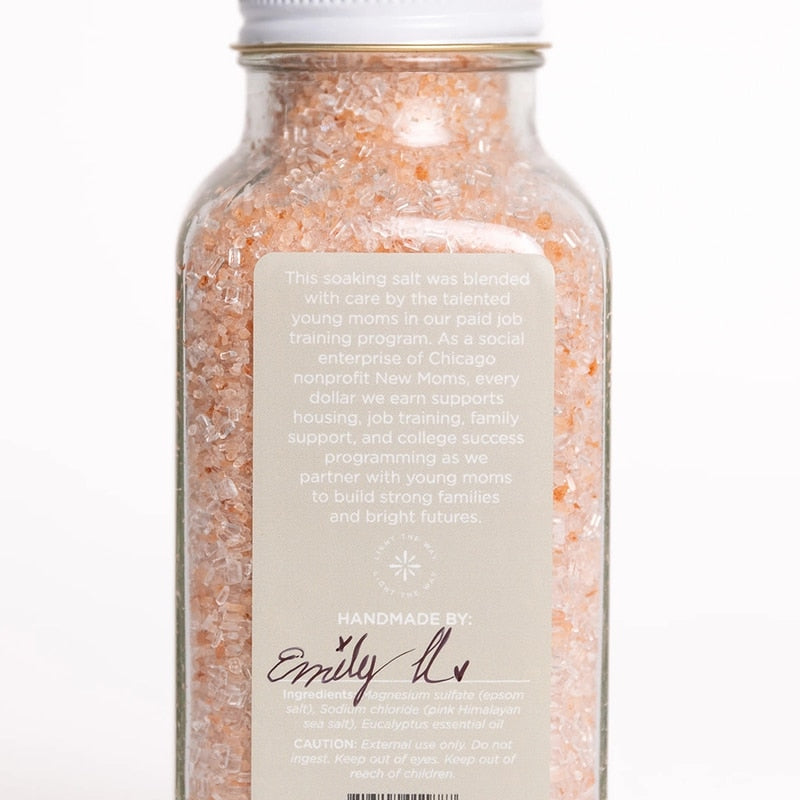 Bright Endeavors eucalyptus bath salts in 16 oz jar with natural mineral crystals and fresh eucalyptus leaves for relaxing bath experience.