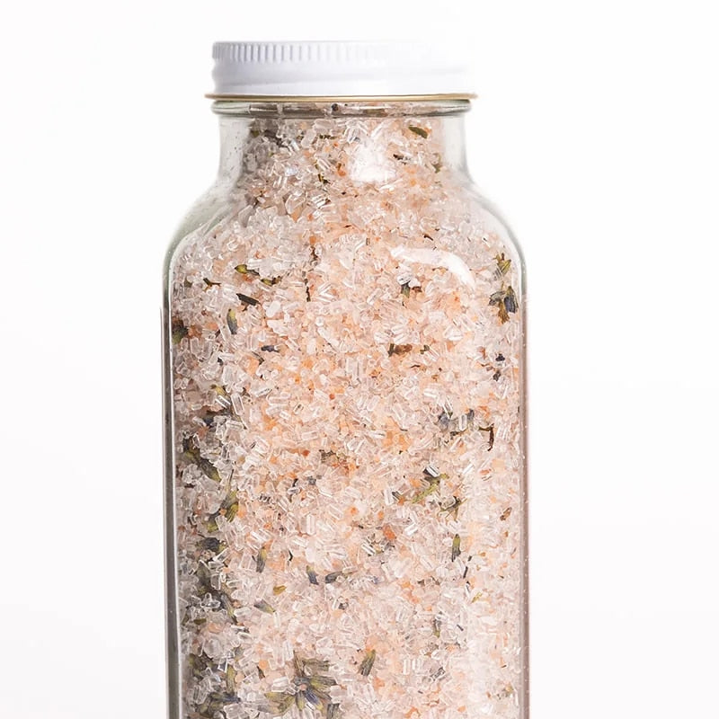 Bright Endeavors 16 oz lavender bath salts in a clear jar with a purple lid, showing lavender flowers and salt crystals inside.